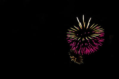 Firework display at night