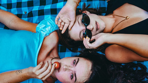 Portrait of young couple lying down