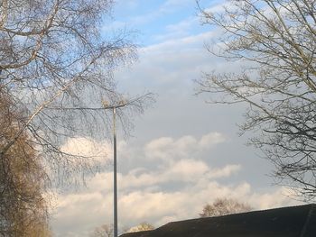 Low angle view of bare tree against sky