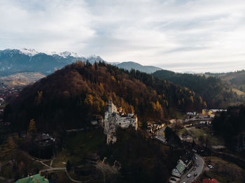 Bran castle on mountain against sky