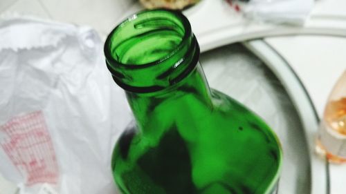 High angle view of green bottle