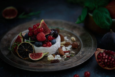 Close-up of fruits in plate on table