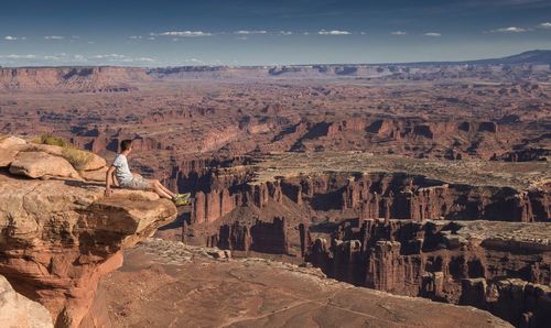 Man sitting on rock formation