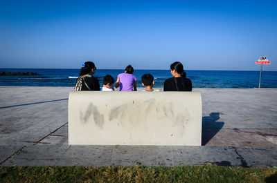 People relaxing on beach