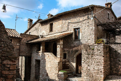 Low angle view of old building against sky