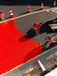 High angle view of red umbrella on road in city