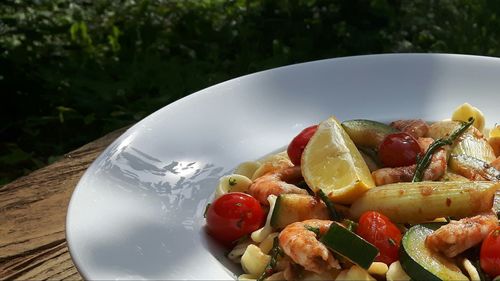 High angle view of fruits in plate on table