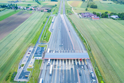 Car traffic transportation on multiple lanes highway road and toll collection gate .a2 poland lodz