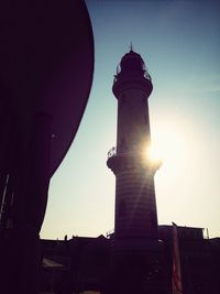 Low angle view of tower at sunset