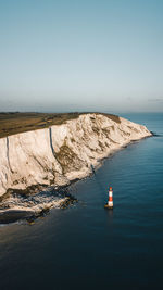 Aerial view of lighthouse in sea