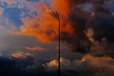 Low angle view of dramatic sky during sunset