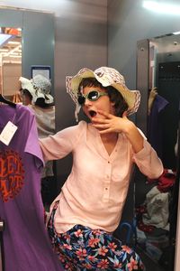 Midsection of woman standing in store