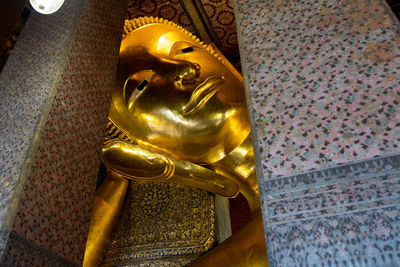 Statue of buddha against building