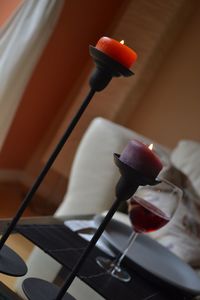 Close-up of illuminated candles on table