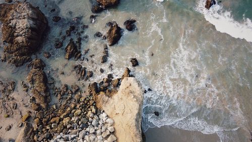 High angle view of rocks in sea