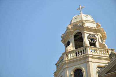 Low angle view of building against clear blue sky