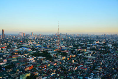 High angle view of city buildings against clear sky