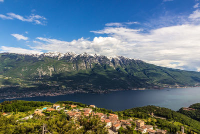 Scenic view of sea and mountains against sky