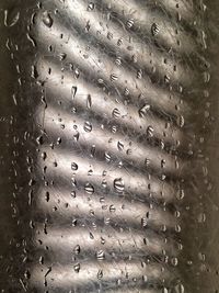 Close-up of water drops on glass