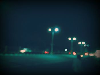 Defocused image of illuminated lights at night