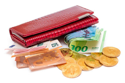 High angle view of paper currency on white background