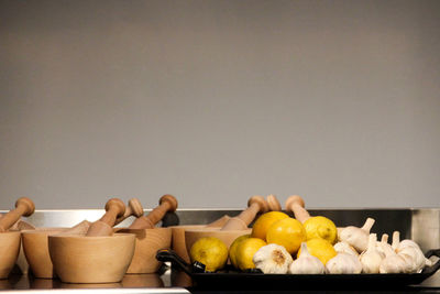 Close-up of fruits against gray background