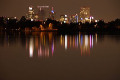 Reflection of illuminated buildings in water at night