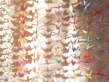 High angle view of colorful paper cranes on table