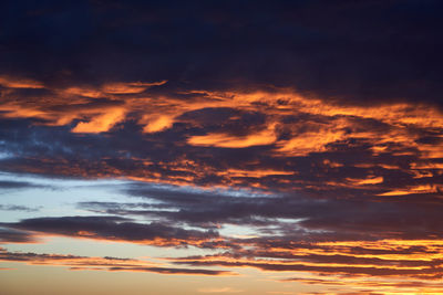 Low angle view of dramatic sky during sunset