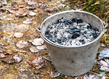 High angle view of cigarette in container on field