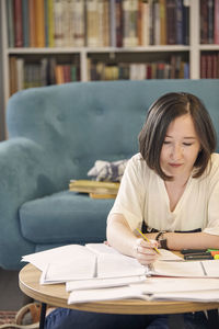 Young woman studying at home