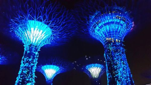 Illuminated ferris wheel at night