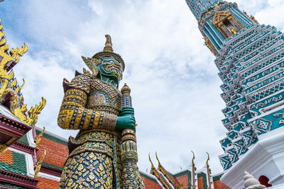 Low angle view of statue of building against sky