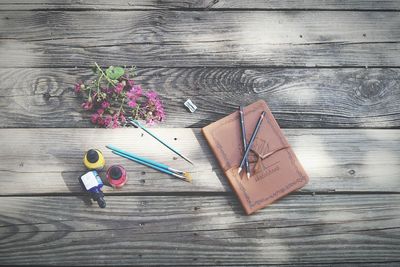 High angle view of sketch pad on wooden table