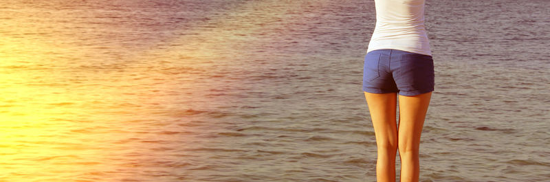 High angle view of woman standing on beach