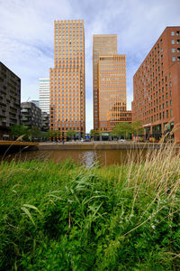 Amsterdam, netherlands - symphony buildings in  district zuidas. viewed from de boelgracht canal.