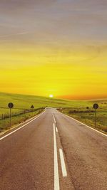 Scenic view of landscape at sunset