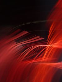 Close-up of light painting against black background