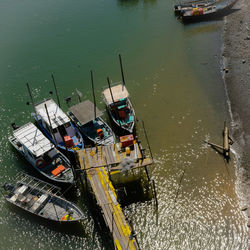 High angle view of fishing boats moored in lake