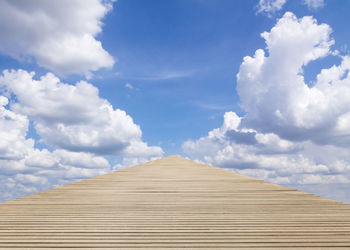 Low angle view of wooden structure against sky