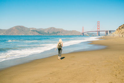 Woman walking on beach