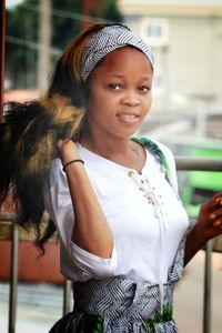 Portrait of smiling girl standing outdoors