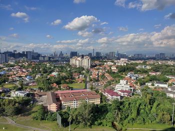 High angle view of townscapes against sky. 