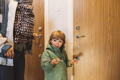 Smiling boy holding apartment keys