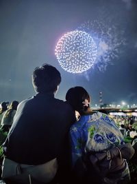 A japanese couple watching fireworks 