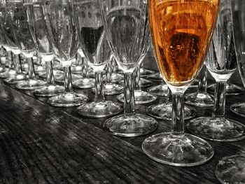 Close-up of wine glasses on table