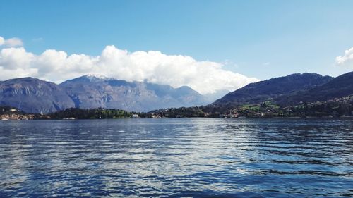 Scenic view of lake and mountains against sky