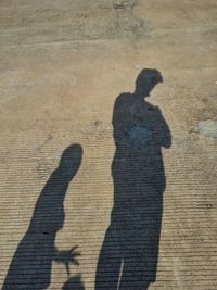Shadow of couple on wall