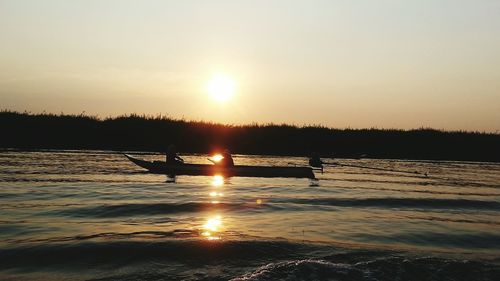 Scenic view of sunset over river