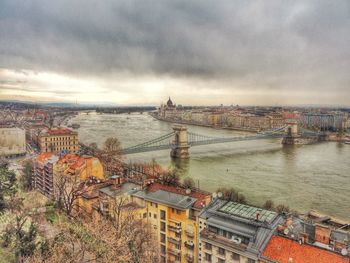 Cityscape against cloudy sky